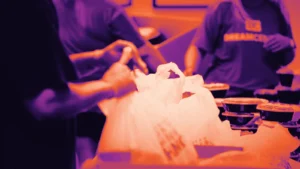 Volunteers packing donations, in Arcsen colours