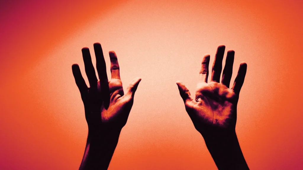 Two hands raised against the sky, in Arcsen colours