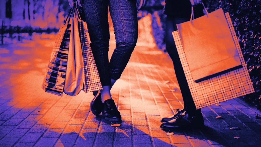Shoppers walking with shopping bags, in Arcsen colours