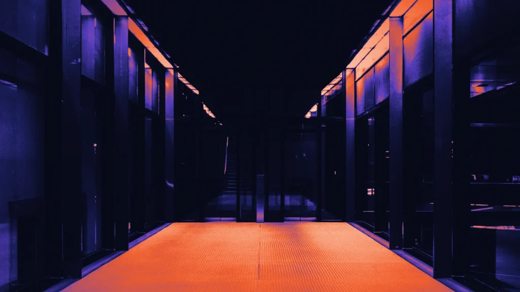 A data centre aisle between server racks, in Arcsen colours