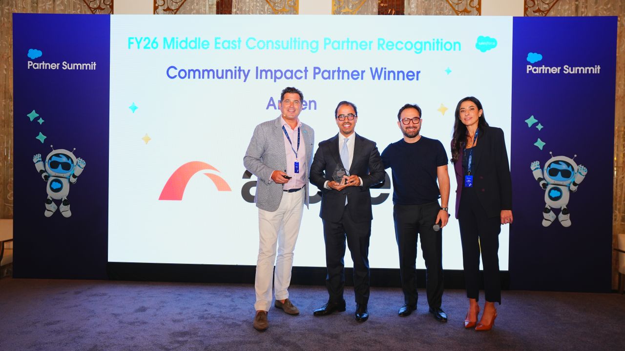 Arcsen receiving the Community Impact Partner award at the FY26 Salesforce Middle East Partner Summit