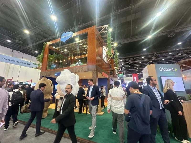The two-storey Salesforce stand at GITEX Global 2024 in Dubai, with Salesforce mascots and visitors