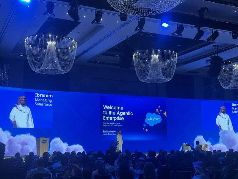 Ibrahim Alseghayr on stage at Salesforce Innovation Day Riyadh 2025, under a screen reading Welcome to the Agentic Enterprise