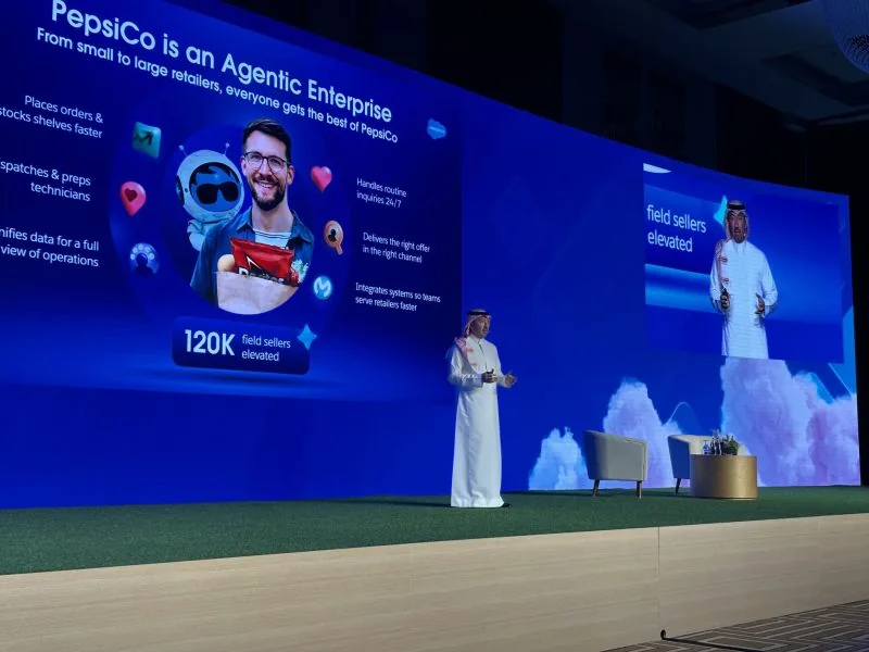 A speaker on stage in front of a slide titled PepsiCo is an Agentic Enterprise at Salesforce Innovation Day Riyadh 2025
