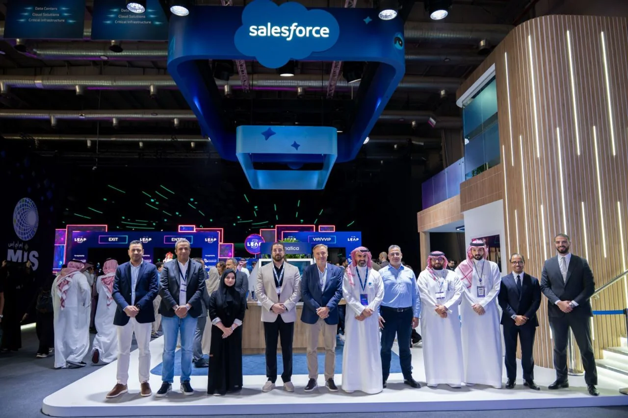 A group standing in front of the Salesforce booth at LEAP 2026 in Riyadh