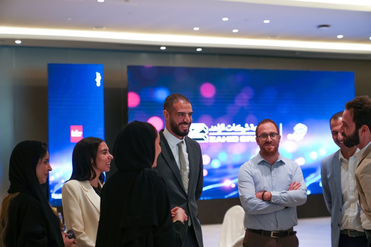 Arcsen colleagues talking at the Zahid Group go-live celebration