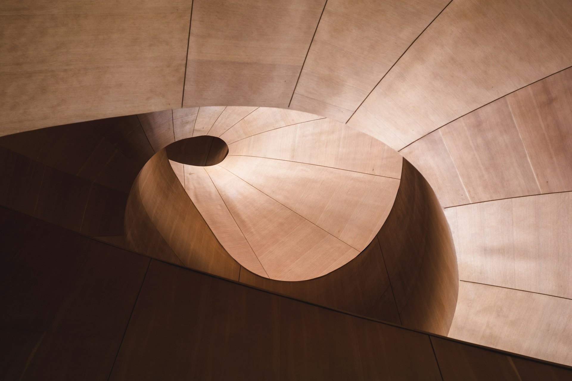 Spiral architecture descending into darkness — a visual metaphor for platform migration