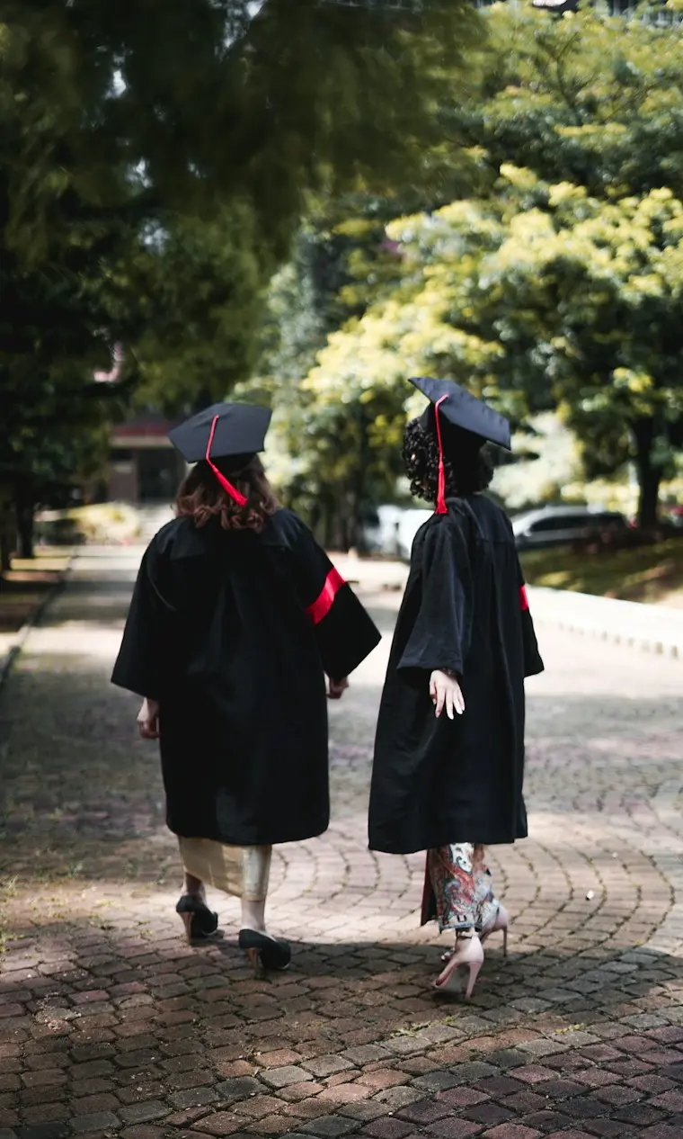 Graduates walking on a university campus