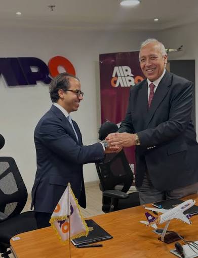 Air Cairo Chairman and CEO Hussein Sherif shakes hands with Arcsen CEO Mohamed Abdelsalam at the CRM agreement signing at Air Cairo headquarters